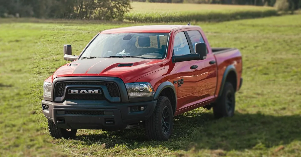 Red diesel pickup truck parked in a field