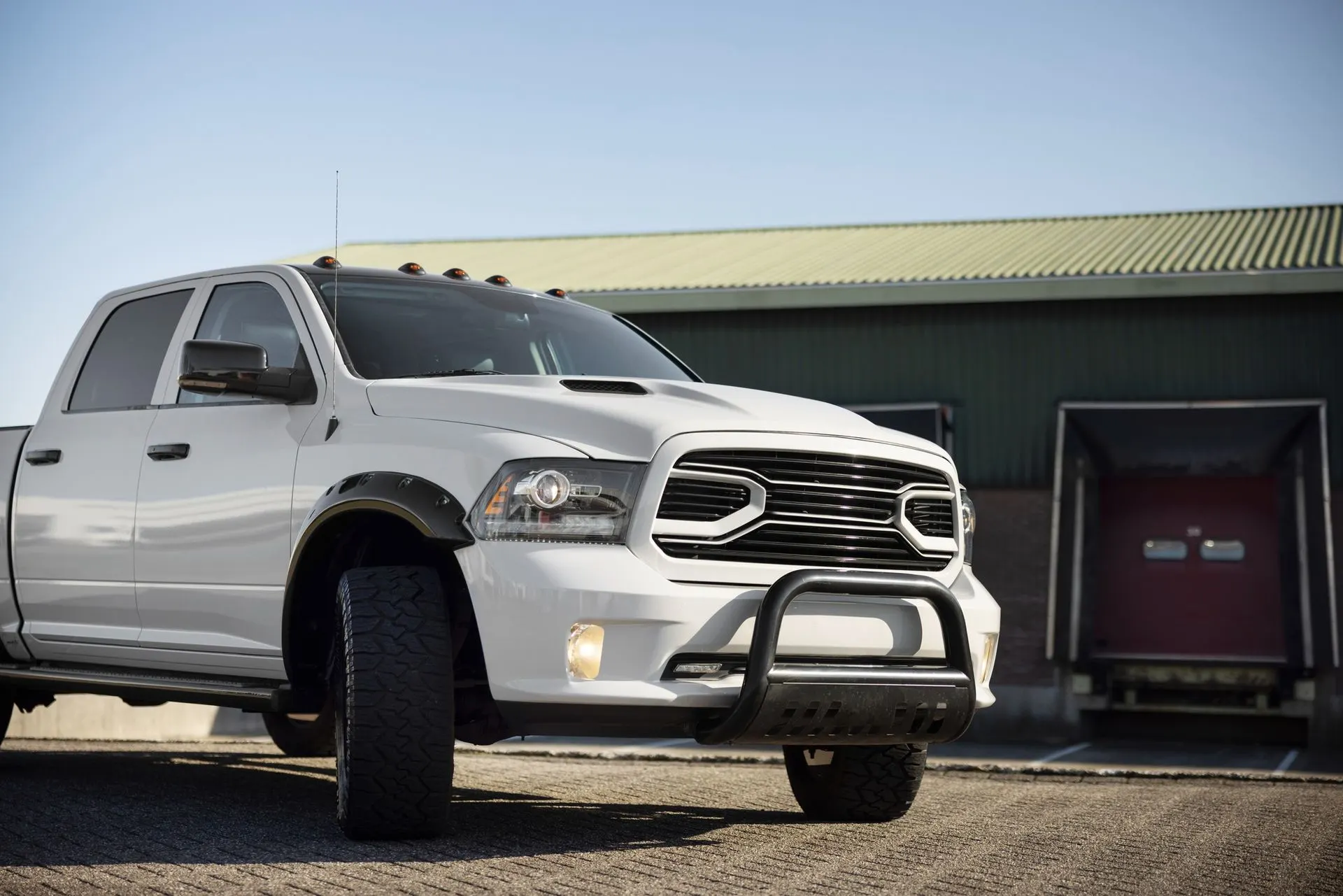 Side view of a modern white vehicle outdoors