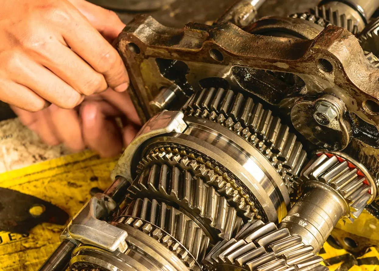 Technicians repairing a truck gearbox at Pro Tech Diesel Inc.